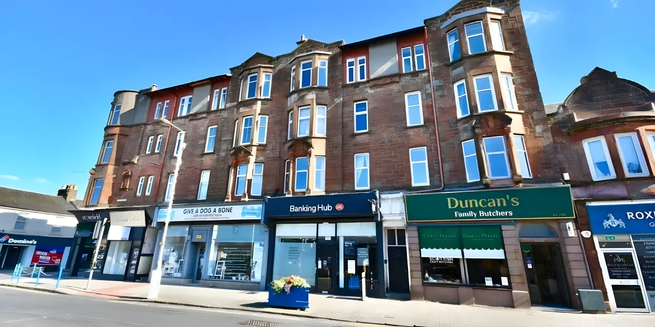 Red sandstone tenement on Ayr Street, Troon, under blue skies
