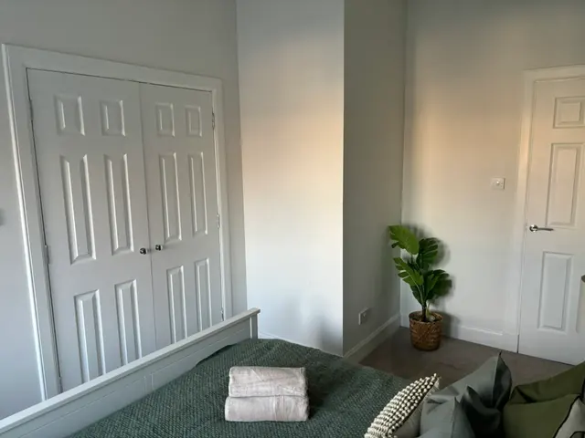 Bedroom with large built-in wardrobes